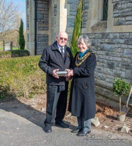 Mayor of Bridgwater, Councillor Liz Leavy and Funeral Director, John Biffen holding a time capsule 